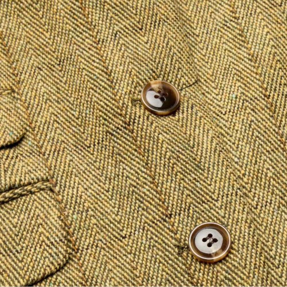 Detail en stof van tweed blazer Elgin staw