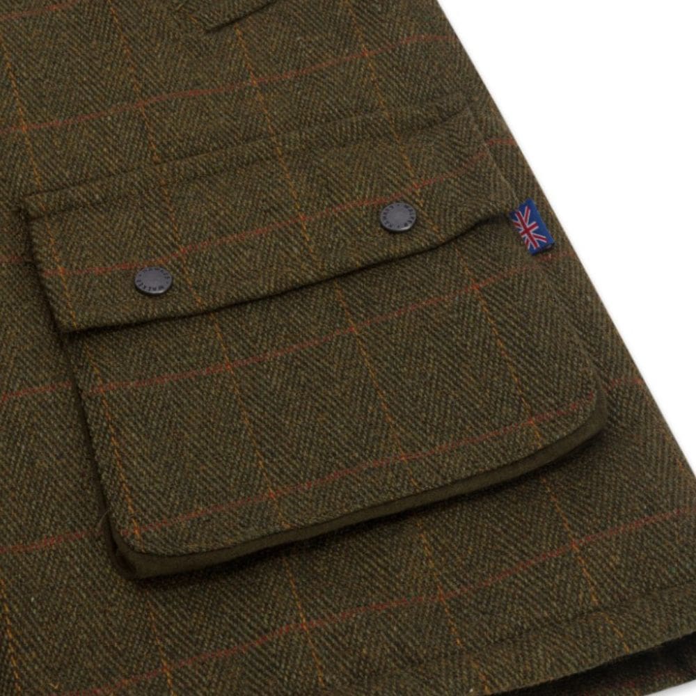 Detail van de zak van een groene tweed waistcoat