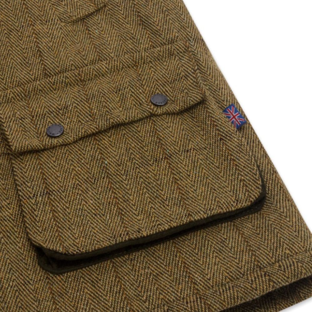 Detail van de zak van de tweed waistcoat voor heren
