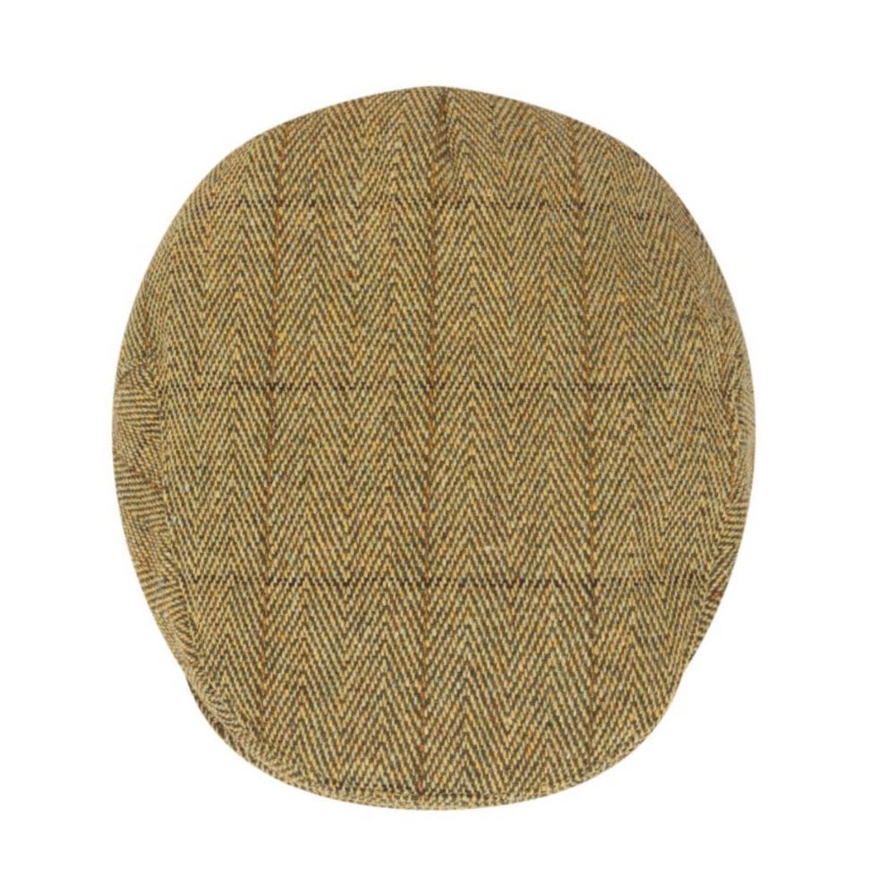 tweed flat cap in stro kleur van boven af gezien