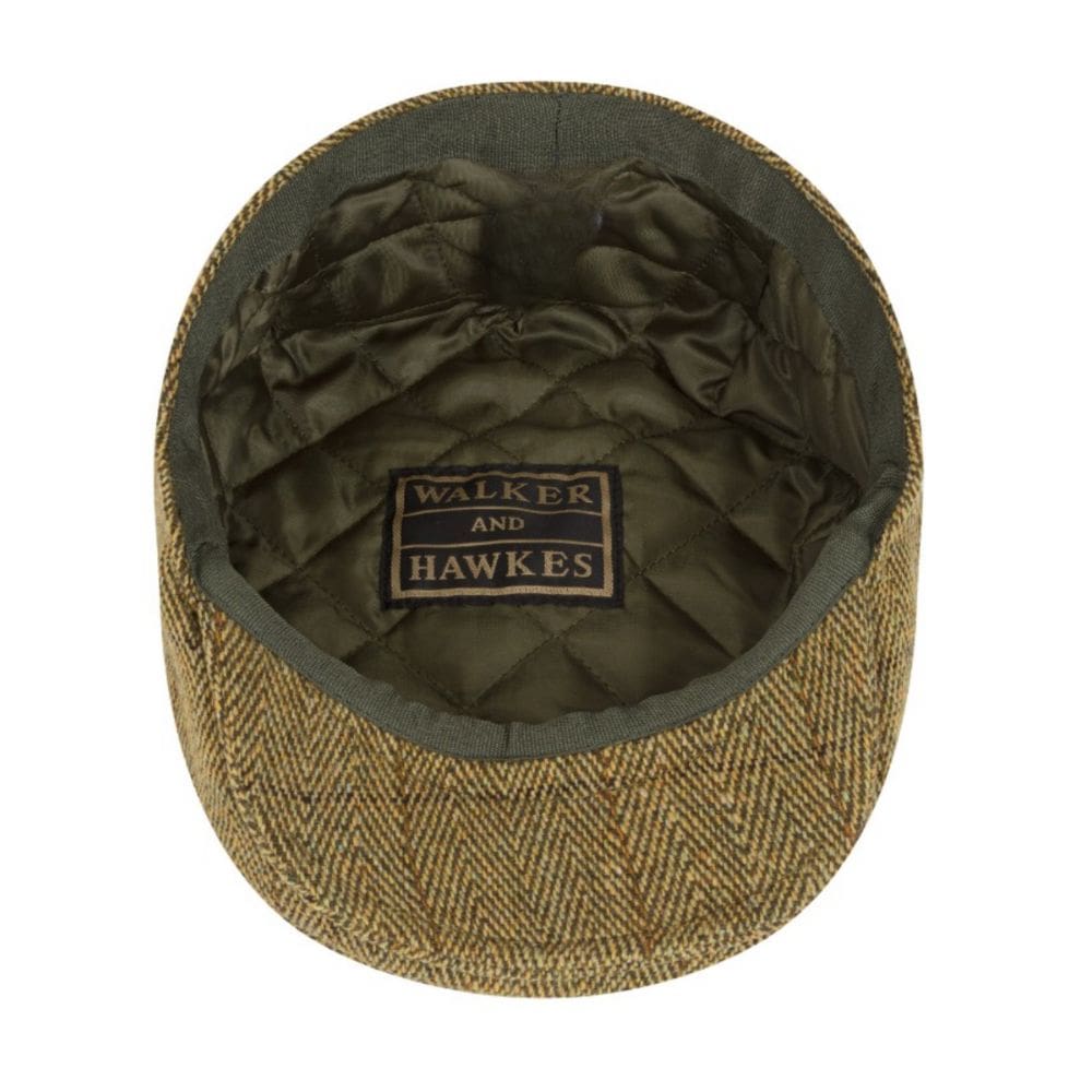tweed flat cap in stro kleur van binnen getoond